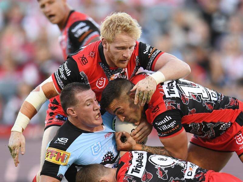 The Dragons' James Graham (top) injured his ankle against the Sharks.