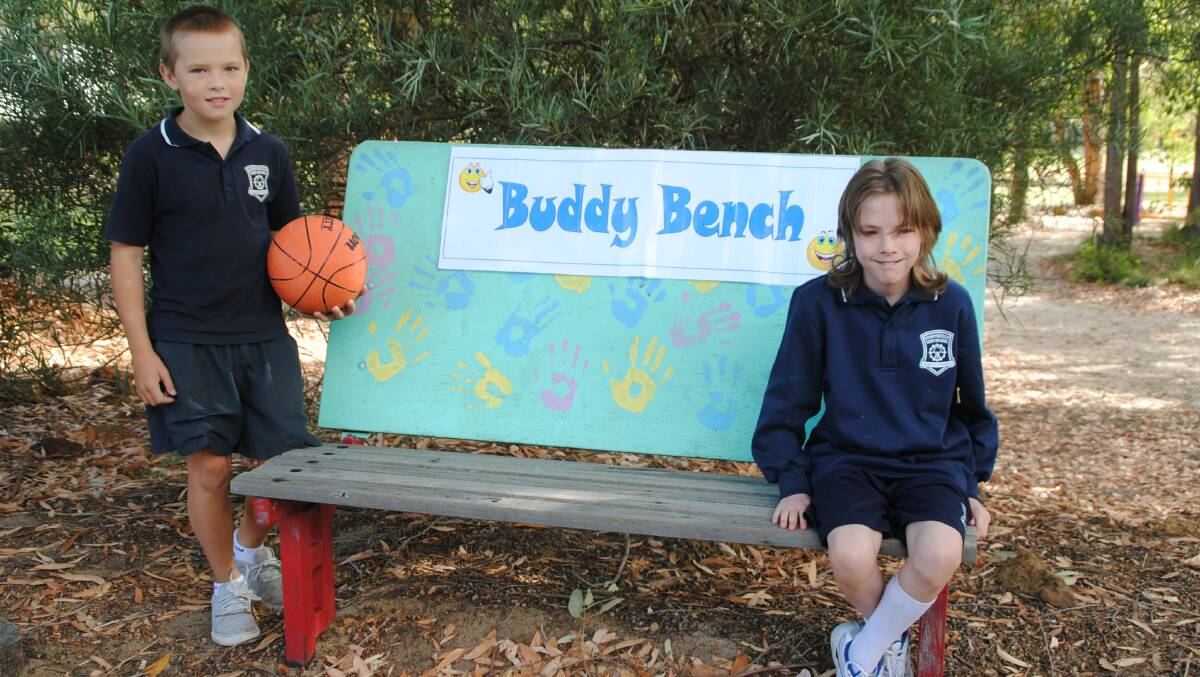 Making friends: Malachi Falkous, 10, and Tommy Galonski, 12, at the school s buddy seat.