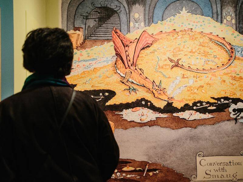 A visitor looks at items of the exhibition Tolkien: Maker of Middle-Earth in New York.