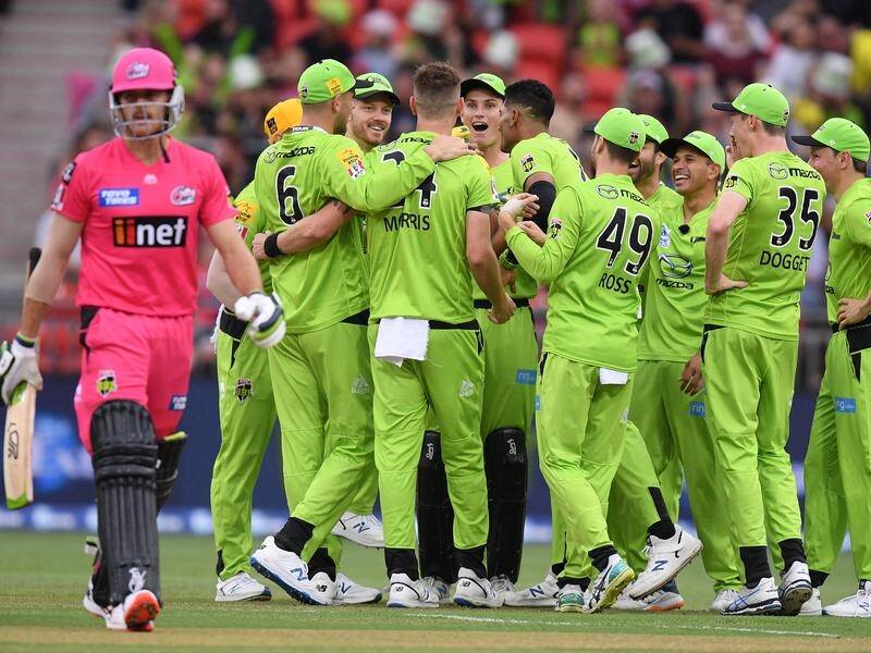 Chris Morris celebrates an early wicket as the Sydney Thunder skittled the Sydney Sixers for 76.