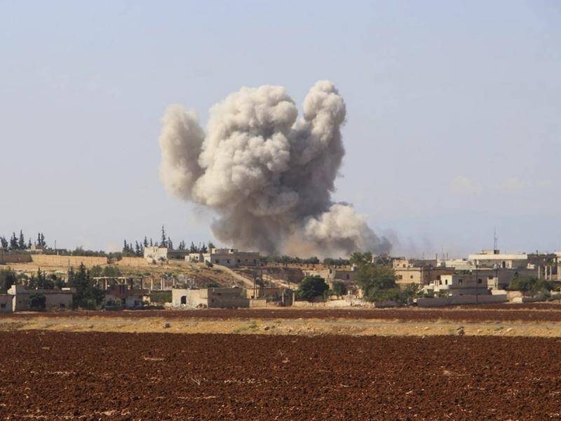 Smoke rises over a village near Syria's Idlib, a last remaining opposition stronghold.