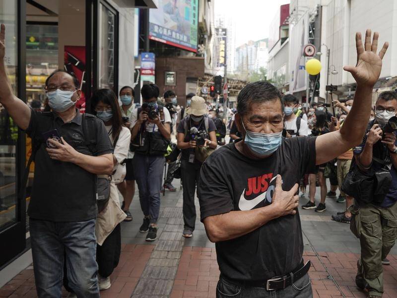 Protesters march in Hong Kong on China's National Day.