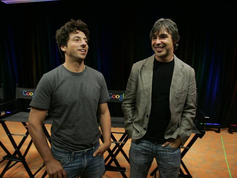 Google co-founders Sergey Brin (L) and Larry Page will step down from roles at its parent company.