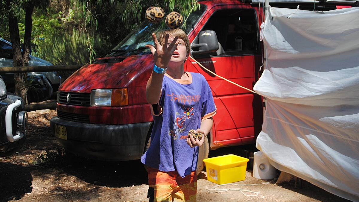 Django Featherstone, 10, puts his juggling skills to use.