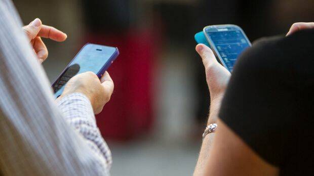 Almost 70 per cent of Crime Stoppers' online traffic is derived from mobiles phones. Photo: Glenn Hunt