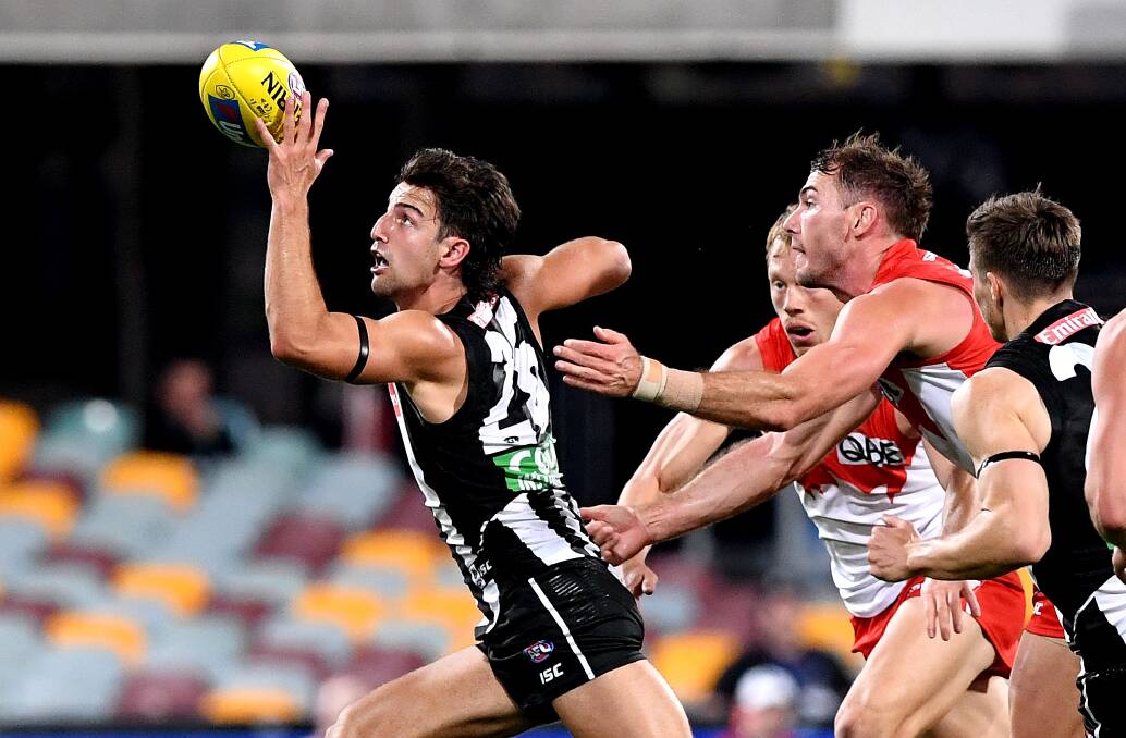 Magpie Josh Daicos controls the ball during the round 10 AFL clash between Collingwood and the Sydney Swans. Photo: Bradley Kanaris/Getty Images