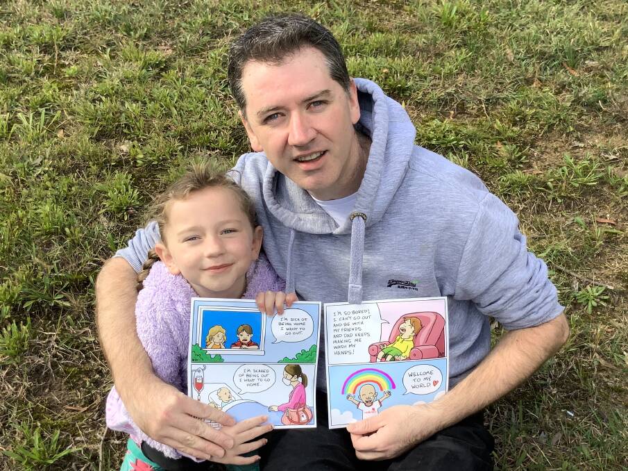 NSW Local Hero Award recipient Angus Olsen with daughter Jane and some of the illustrations he created to explain cancer therapy to young patients. Picture supplied by australianoftheyear.org.au 