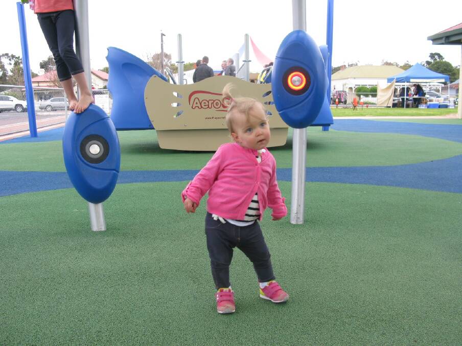 Dancing: Lucy Ford, 19 months, grooves to the sounds of the Neos 360 at the opening of the Apple FunPark extension.